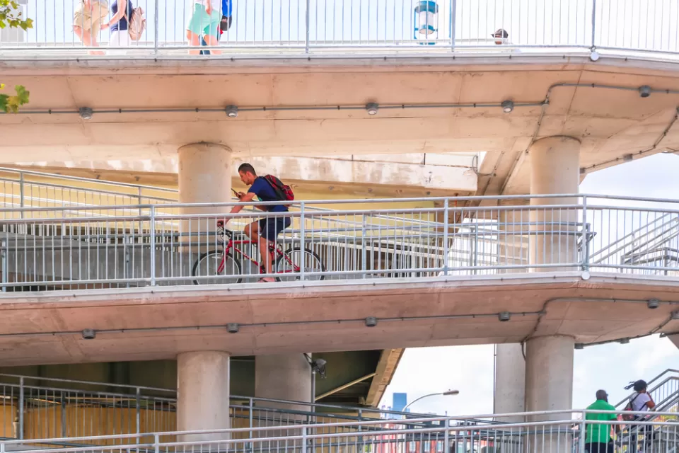 Bike rider on multi-tiered Philadelphia bridge